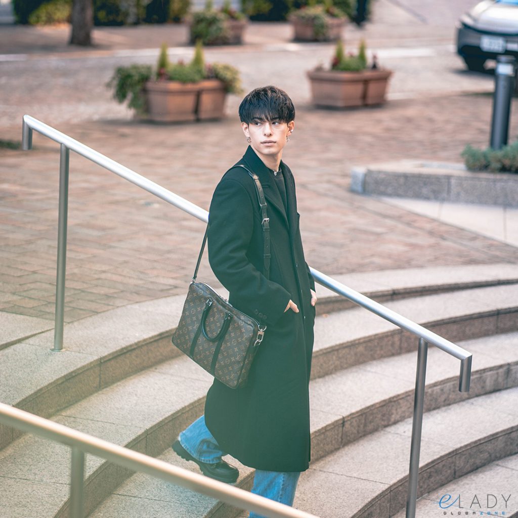 male model wearing a vintage Louis Vuitton bag